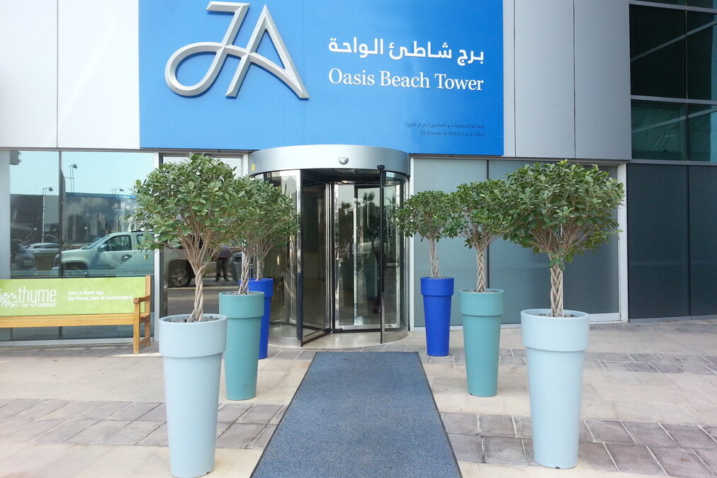 We Love To Put In The Effort To Select The Pot Color To Match Your Company Colors | JA Oasis Beach Tower – Entrance