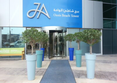 We Love To Put In The Effort To Select The Pot Color To Match Your Company Colors | JA Oasis Beach Tower – Entrance