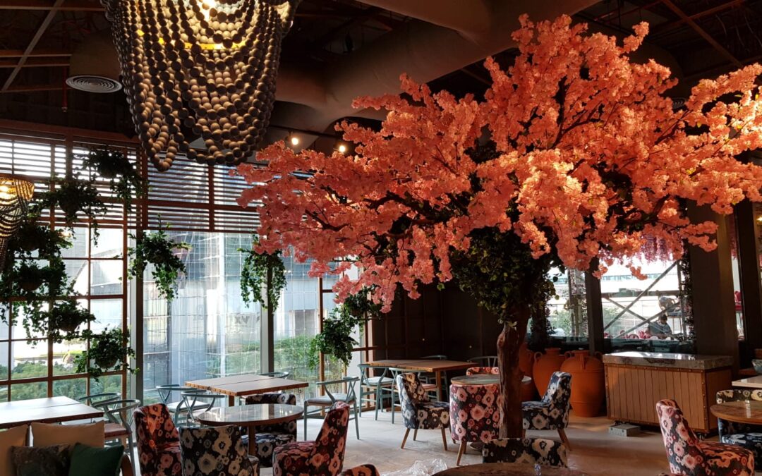 Delightful Artificial trees with decorative hanging plants | GBR and TVM Restaurant