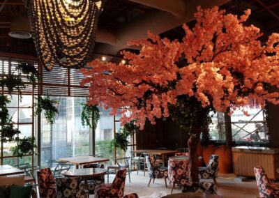 Delightful Artificial trees with decorative hanging plants | GBR and TVM Restaurant